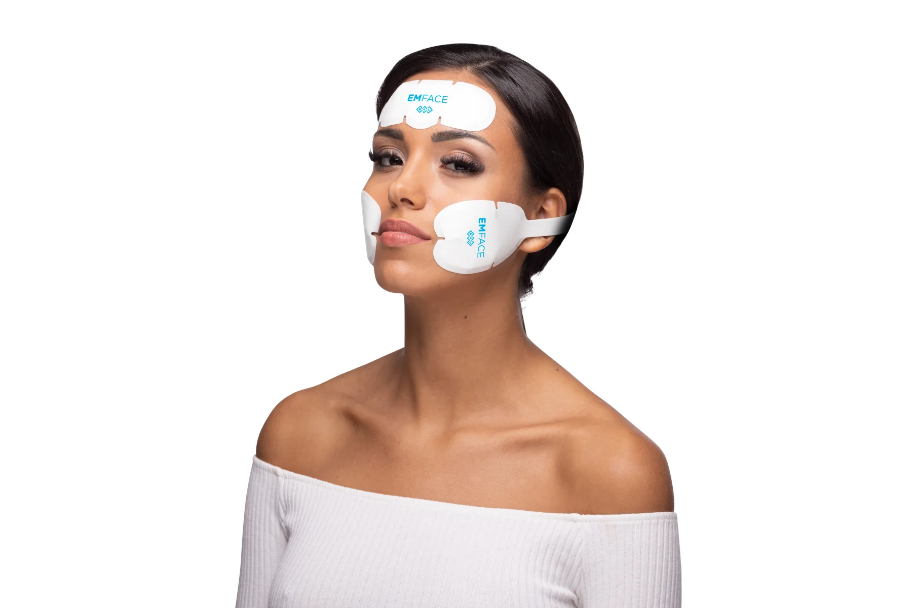 Patient wearing EMFACE applicators on her forehead and cheeks