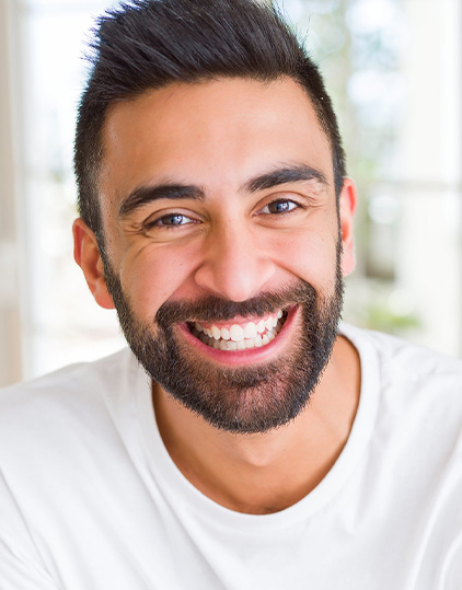 Patient smiling after restorative dental care
